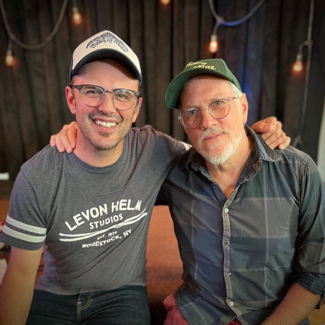 Mark Erelli posing with his songwriting partner Dinty Child in August 2024