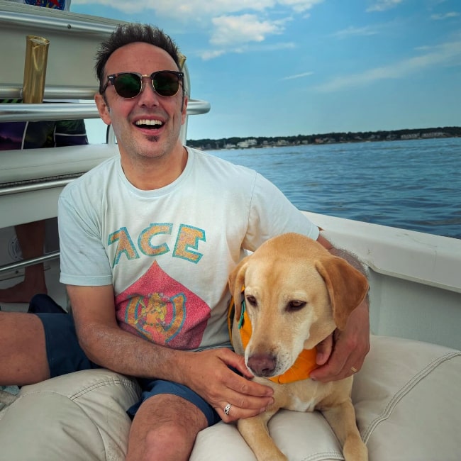 Mark Erelli with his dog Leo out in the water in July 2024